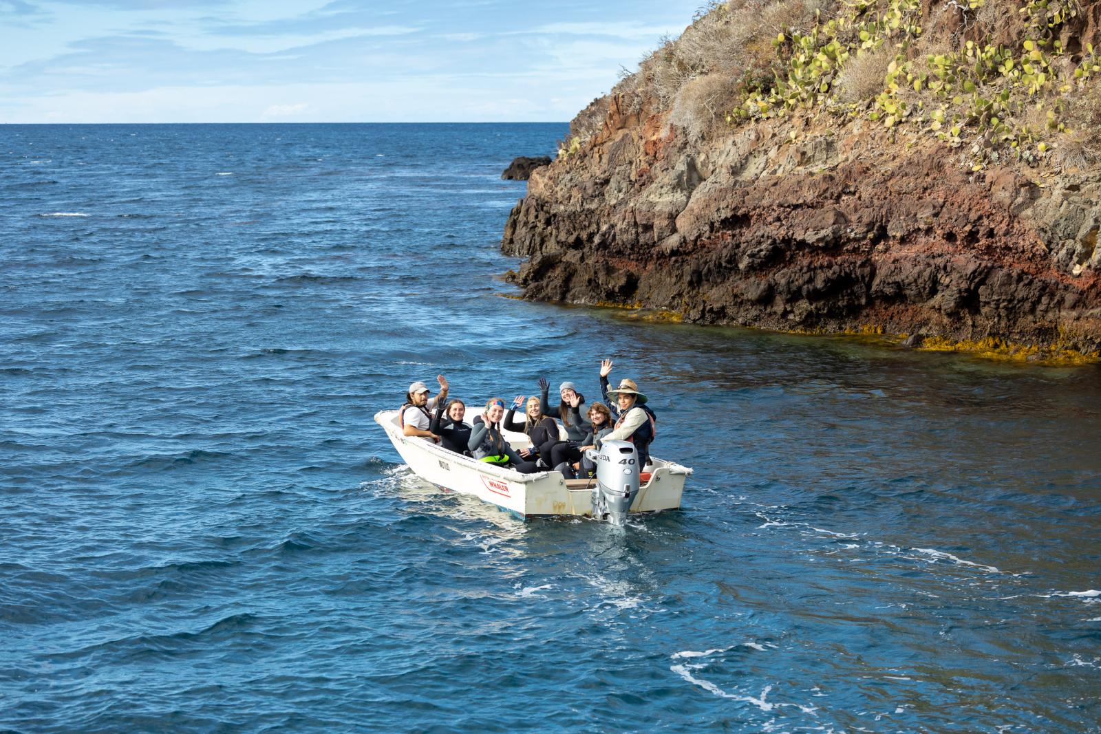 CSULB marine biology students in a boat
