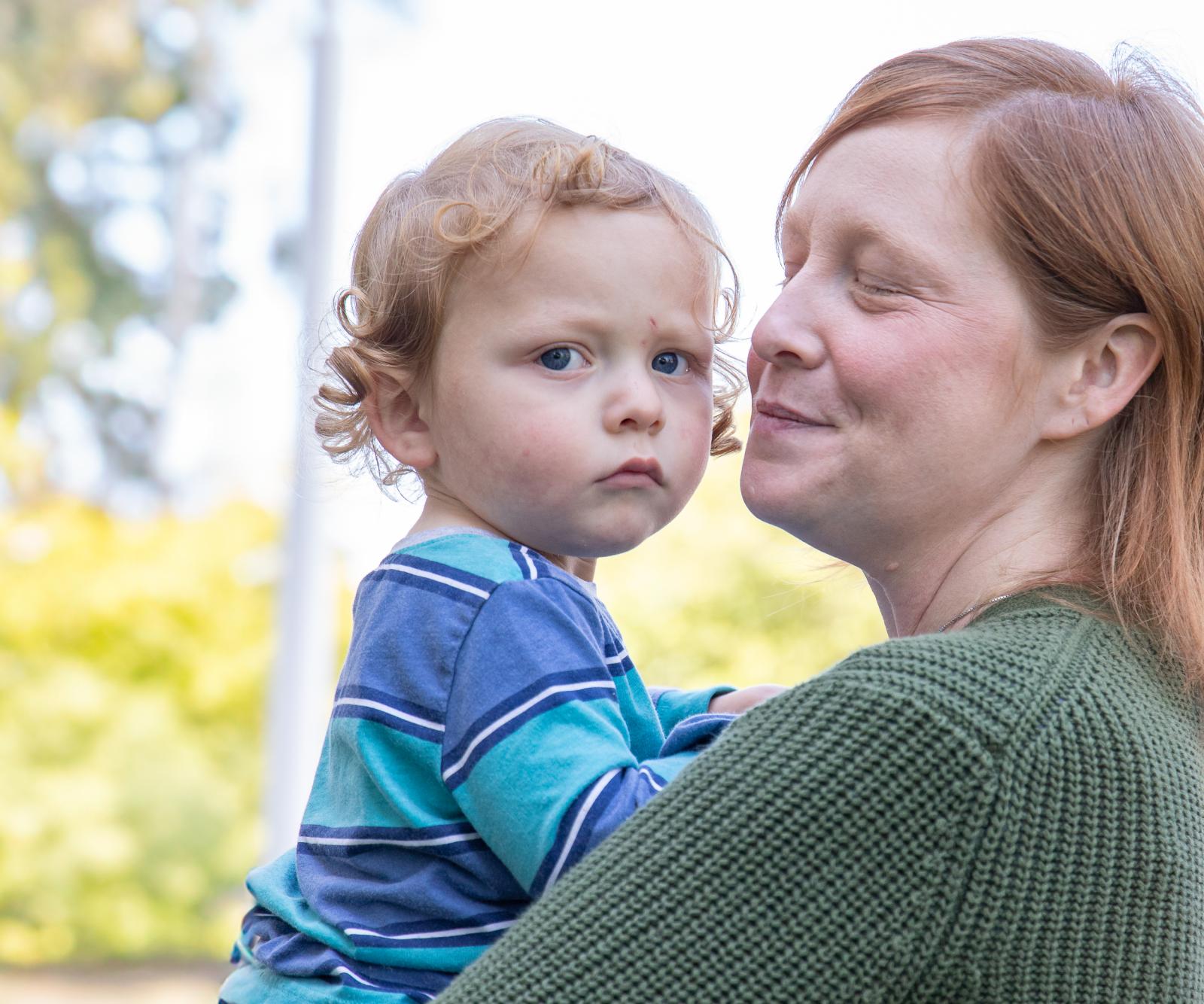 Katie McPherin holds her son Milton