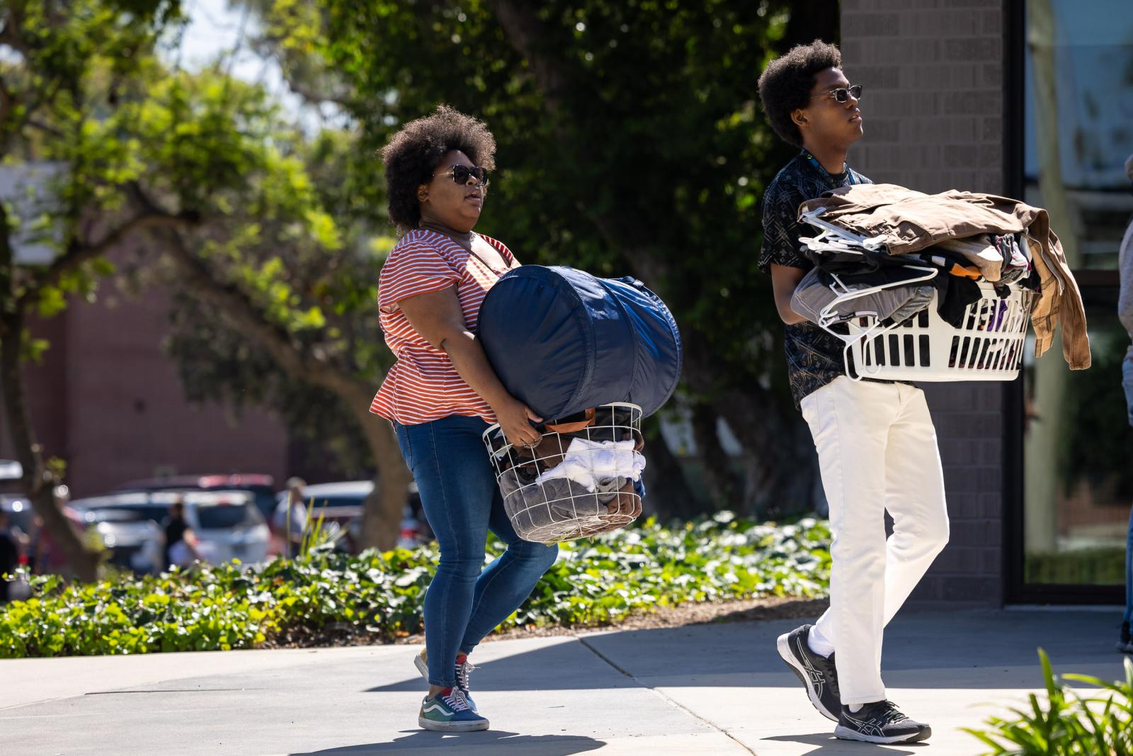 Mother and son moving stuff
