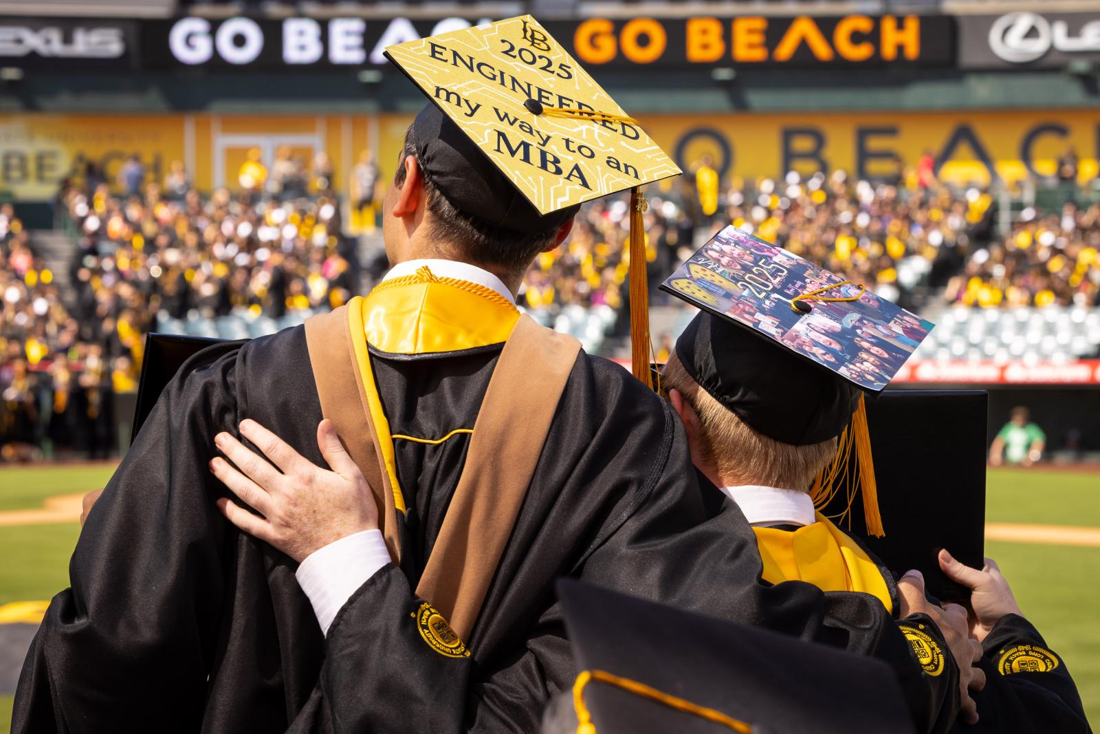 Two graduates of CSULB from behind