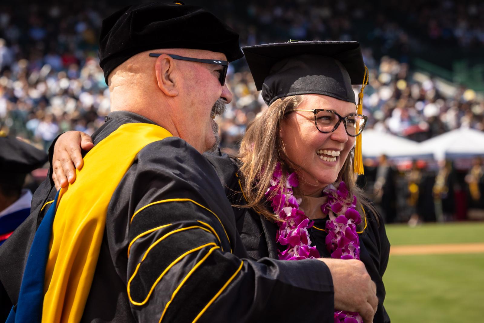 Bruce Mac Rae and graduate at Commencement