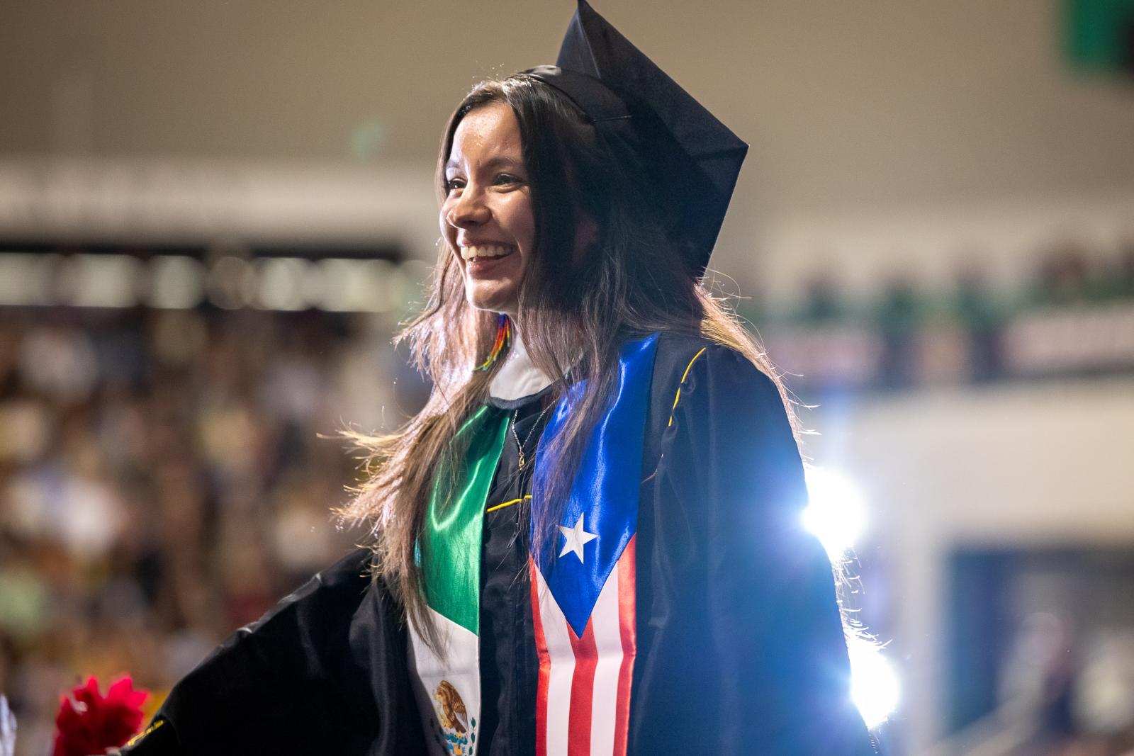 Woman graduate at Latine Cultural Celebration