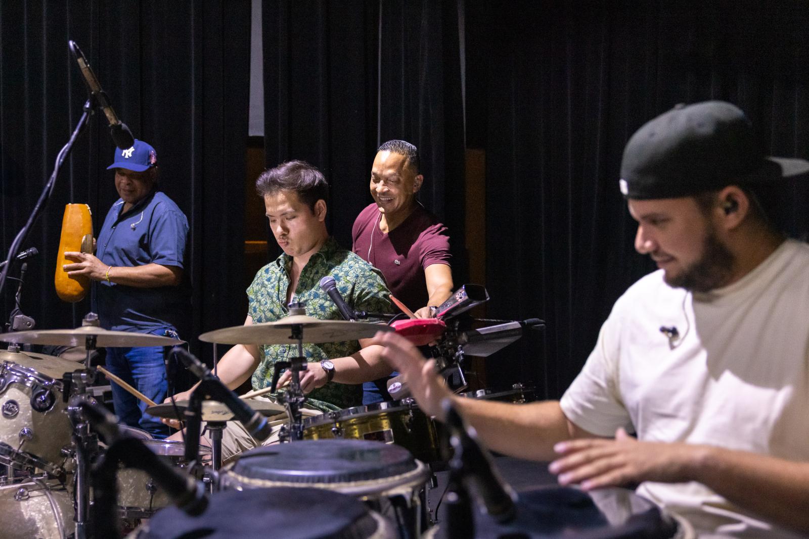 Ryan Dong plays with the Cuban band Los Van Van