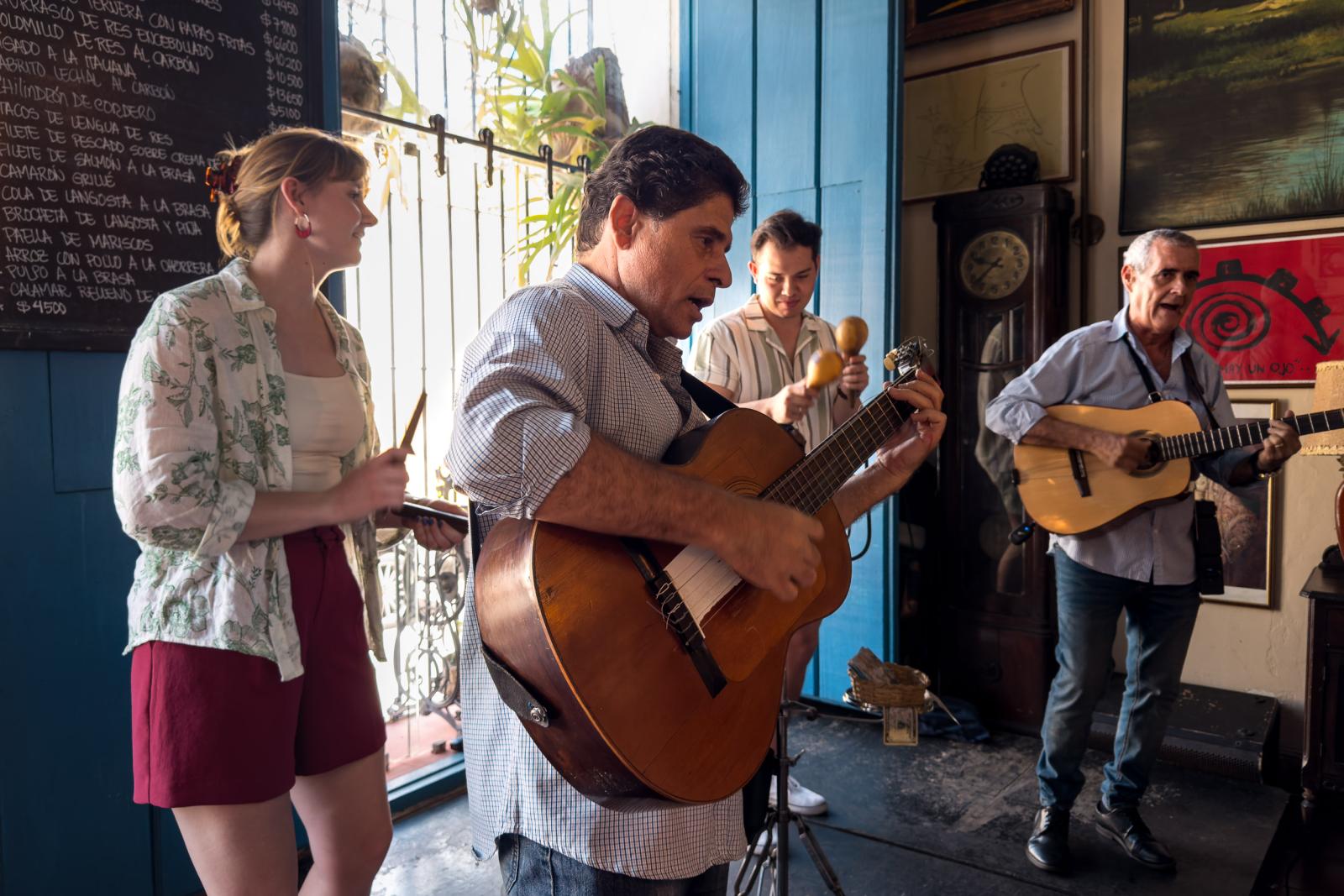 CSULB students perform with Cuban guitarists at Al Carbon restaurant