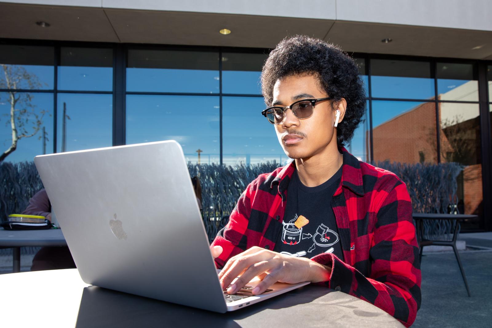 Student using on-campus Wi-Fi Student using on-campus Wi-Fi