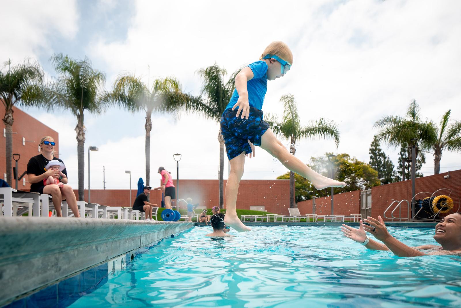 Kids playing at the pool at the Student Recreation and Wellness Center