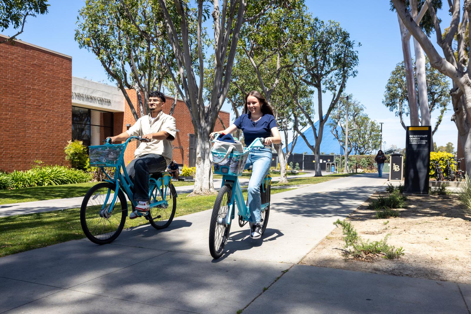 Students riding bikes on campus