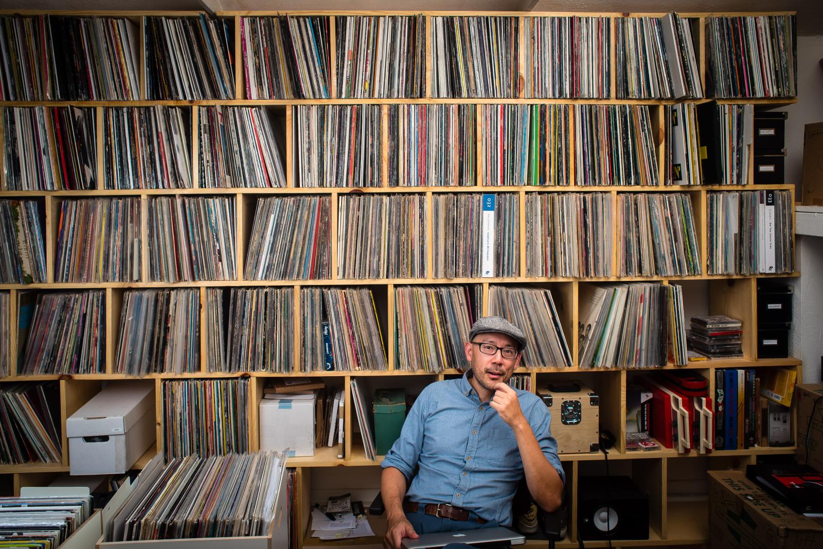 Oliver Wang with his vinyl albums behind him Oliver Wang with his vinyl albums behind him
