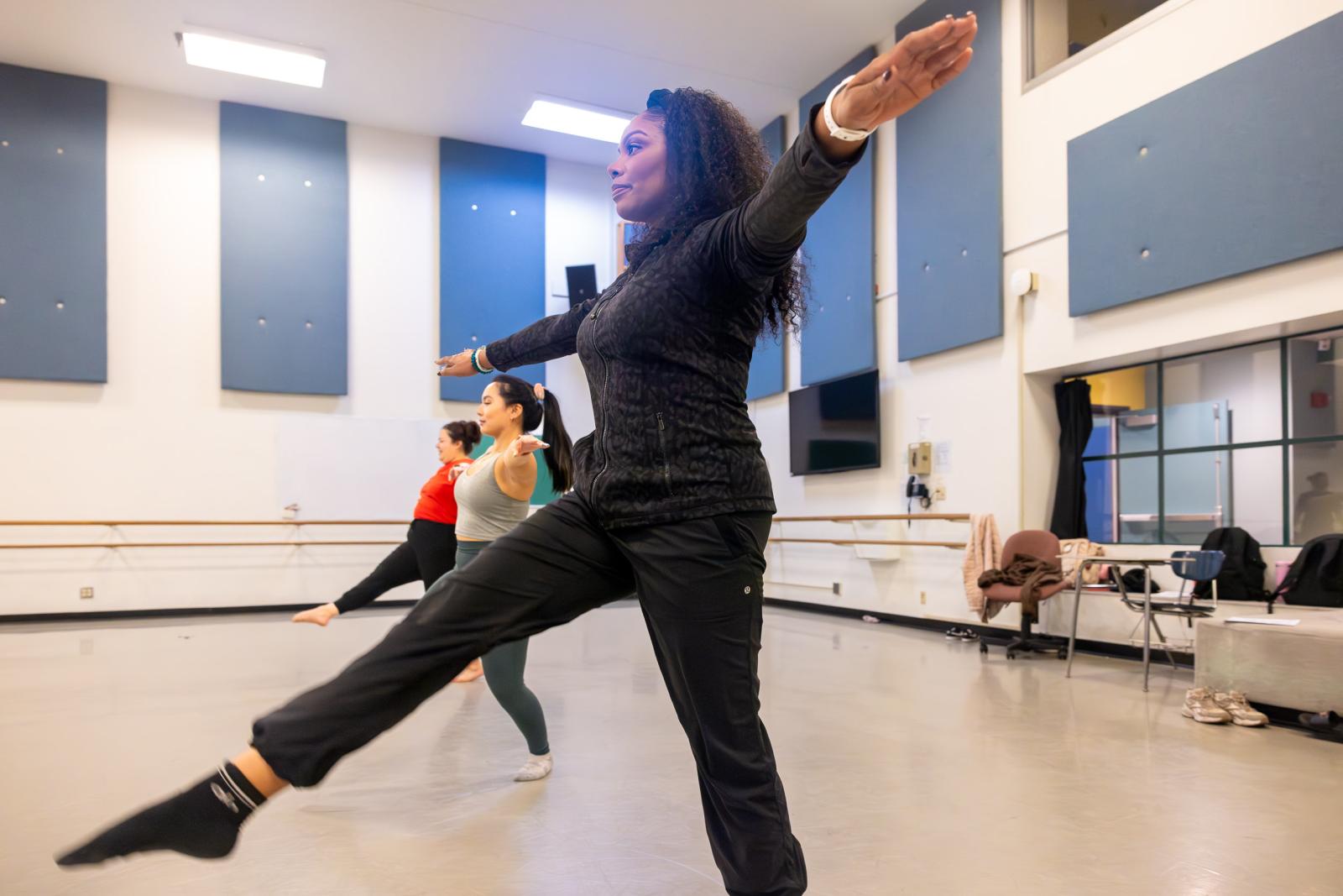 Zakiya Atkinson, front, leads a class of CSULB dance pedagogy students