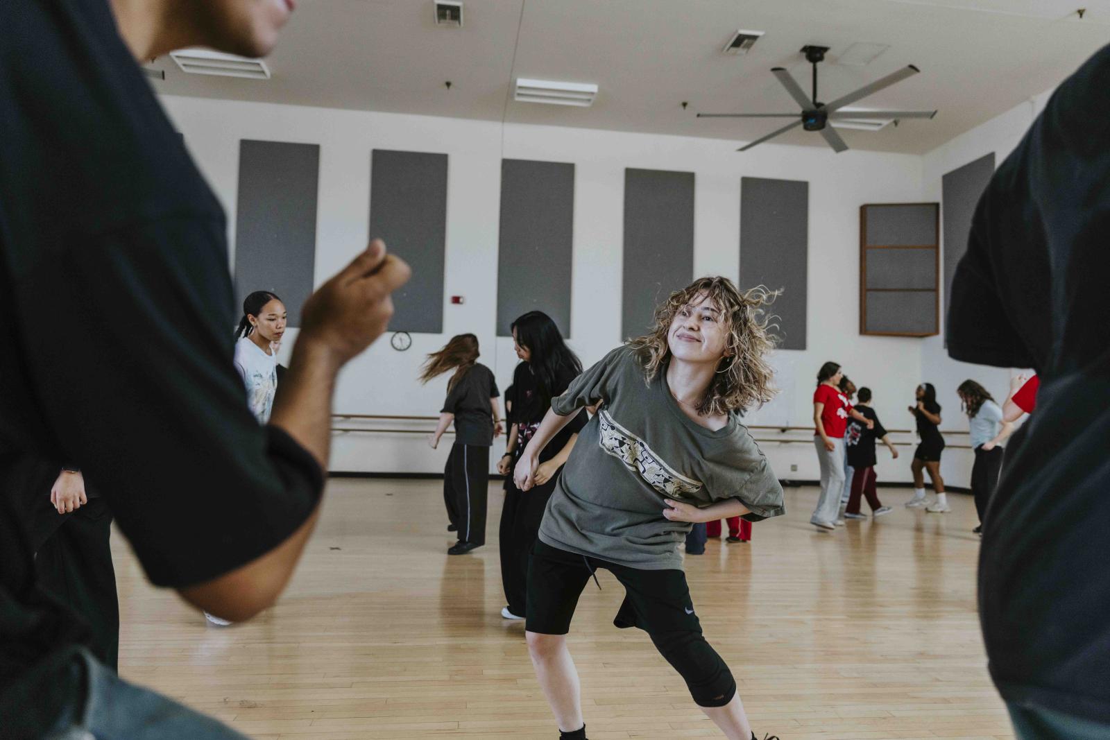 A CSULB dance student learns moves from a Versa-Style instructor