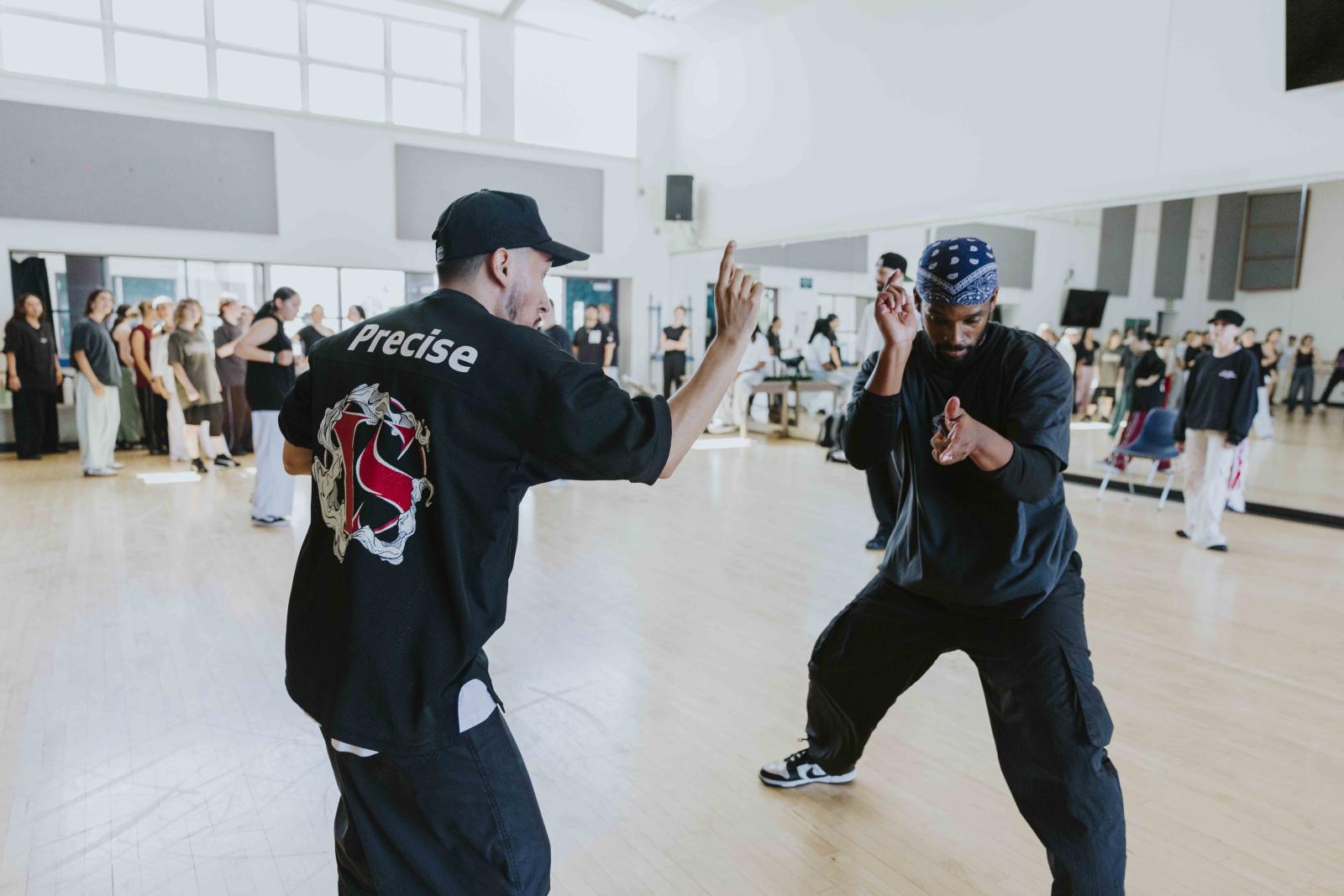 A Versa-Style instructor, left, gives instruction to a CSULB dance student