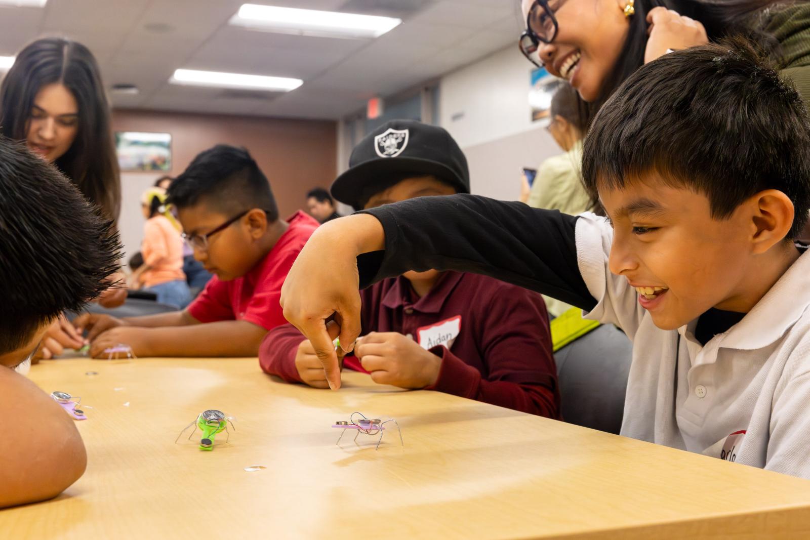 CSULB student teachers help Handy Elementary students build robotic bugs
