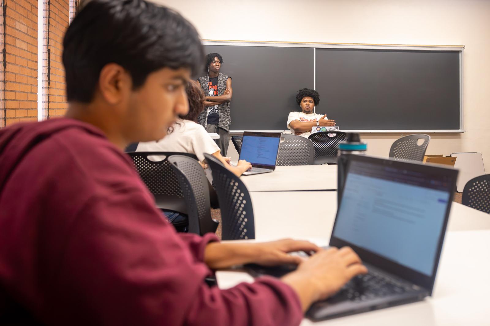 CSULB Student Curtis Ortega, center, at Summer Debate Institute