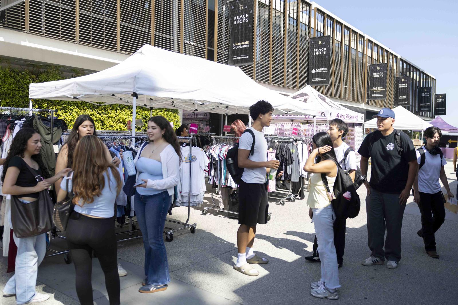 Students gathering at tents in front of bookstore