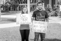 Students holding posters