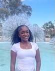 person standing in front of the fountain at brotman hall