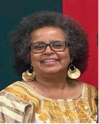 Picture of Ms. Tembo smiling with green and red background