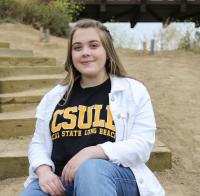 CSULB Alumni sitting on stairs